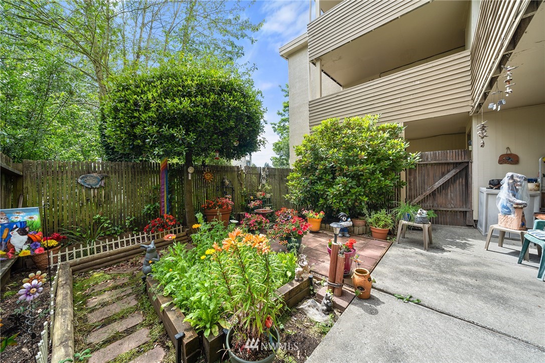 980 Edmonds Avenue Northeast Renton, WA 98056 - Photo 13 of 28 a view of a backyard with sitting area and furniture