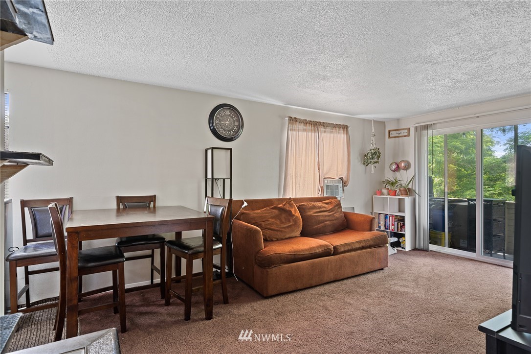 980 Edmonds Avenue Northeast Renton, WA 98056 - Photo 20 of 28 a living room with furniture and a large window