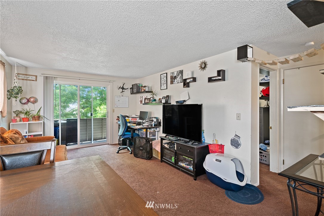 980 Edmonds Avenue Northeast Renton, WA 98056 - Photo 21 of 28 a bedroom with furniture and a window