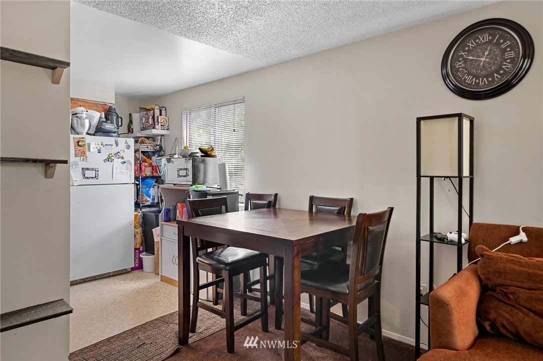 980 Edmonds Avenue Northeast Renton, WA 98056 - Photo 23 of 28 a view of a dining room with furniture and a table