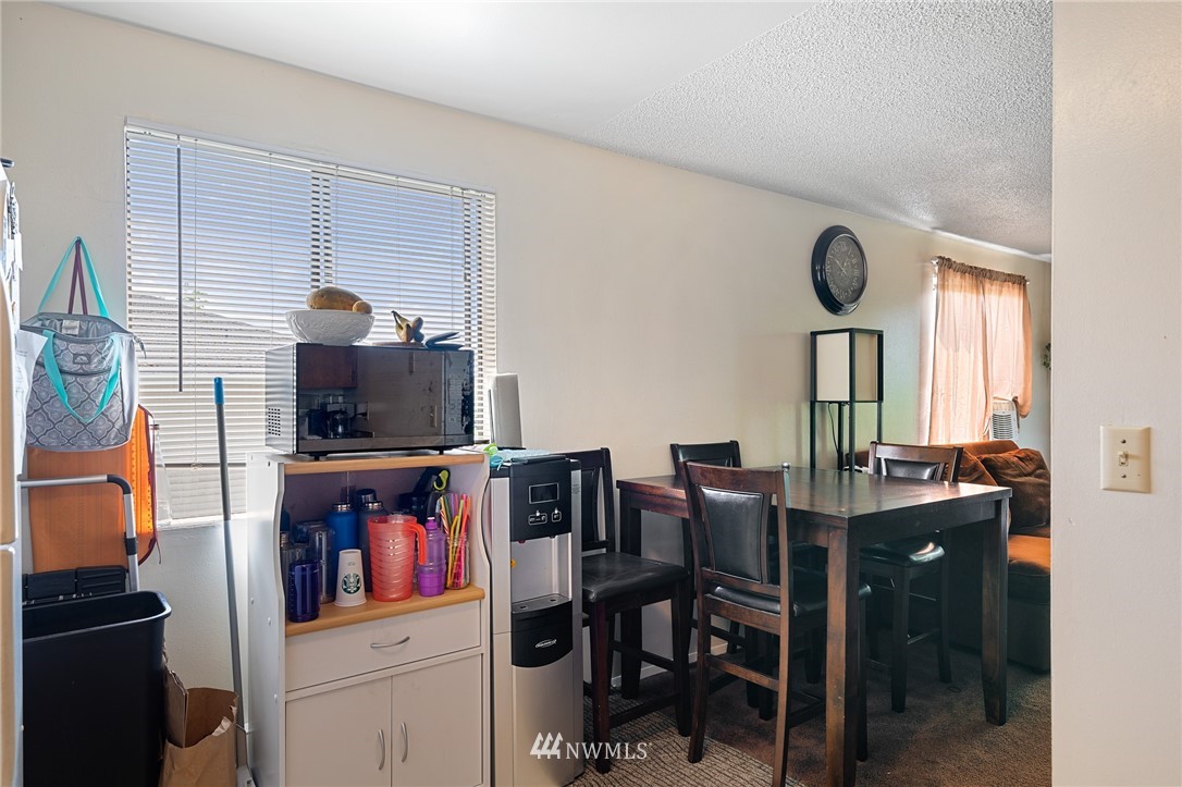 980 Edmonds Avenue Northeast Renton, WA 98056 - Photo 25 of 28 a view of a workspace with furniture and a flat screen tv