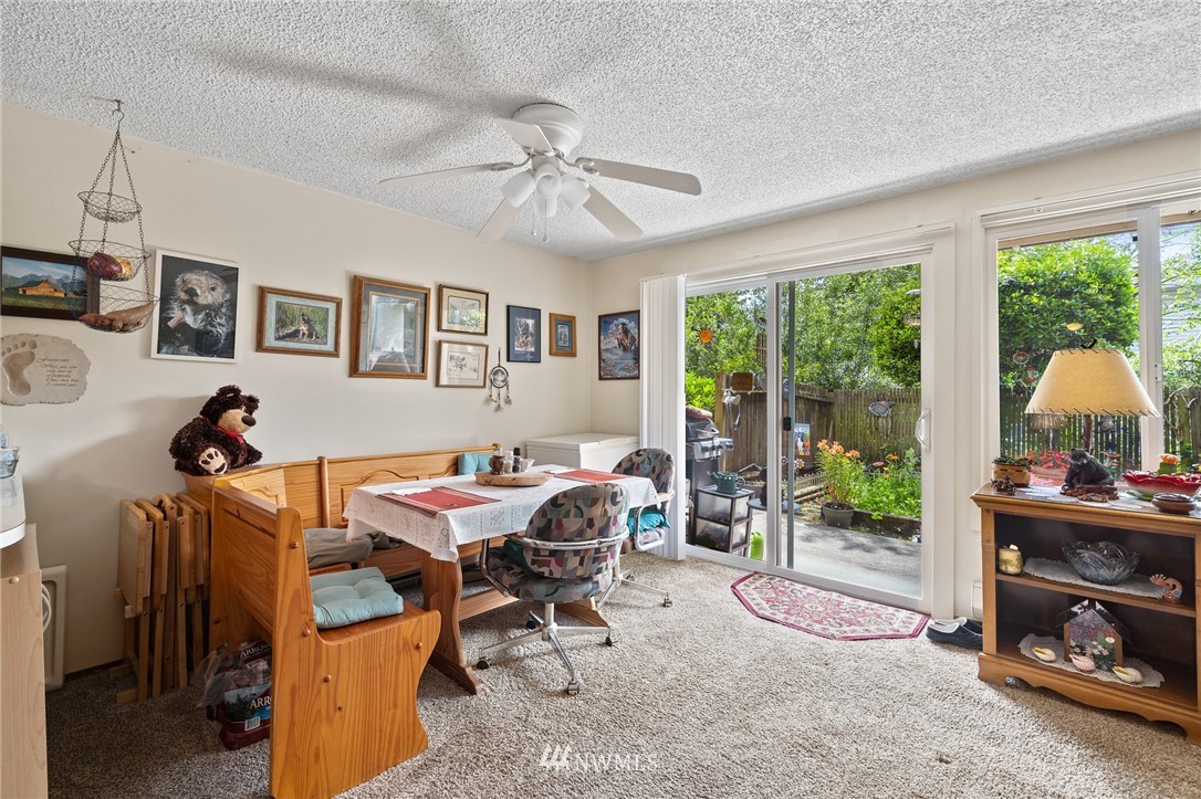 980 Edmonds Avenue Northeast Renton, WA 98056 - Photo 10 of 28 a dining room with furniture and a window