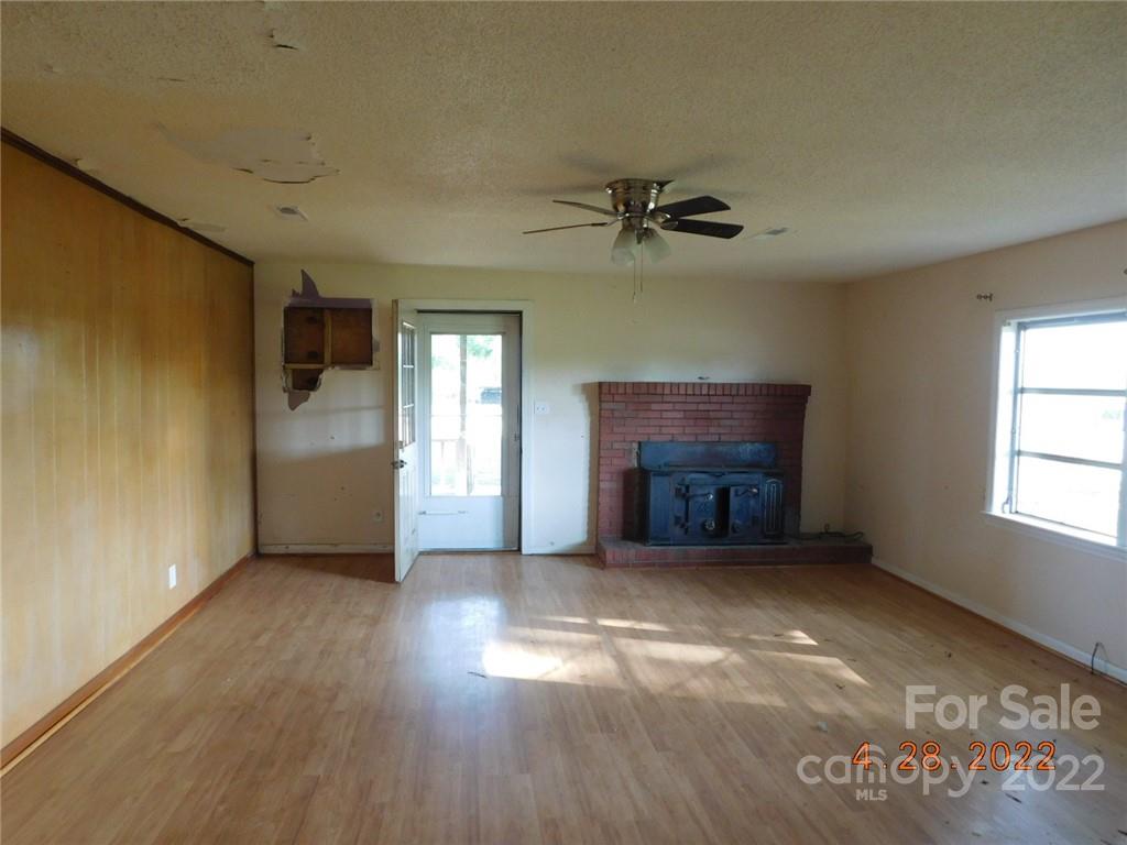 3118 Austin Chaney Road Monroe, NC 28110 - Photo 15 of 15 a view of an empty room with a fireplace and a window