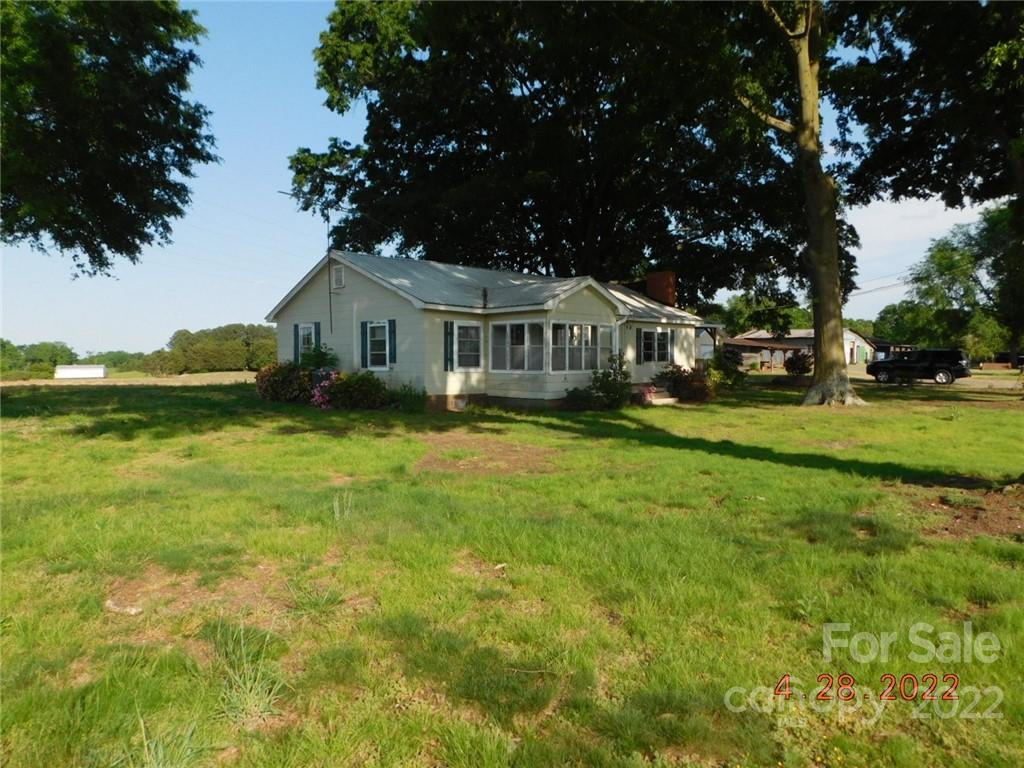 3118 Austin Chaney Road Monroe, NC 28110 - Photo 3 of 15 a front view of a house with a garden