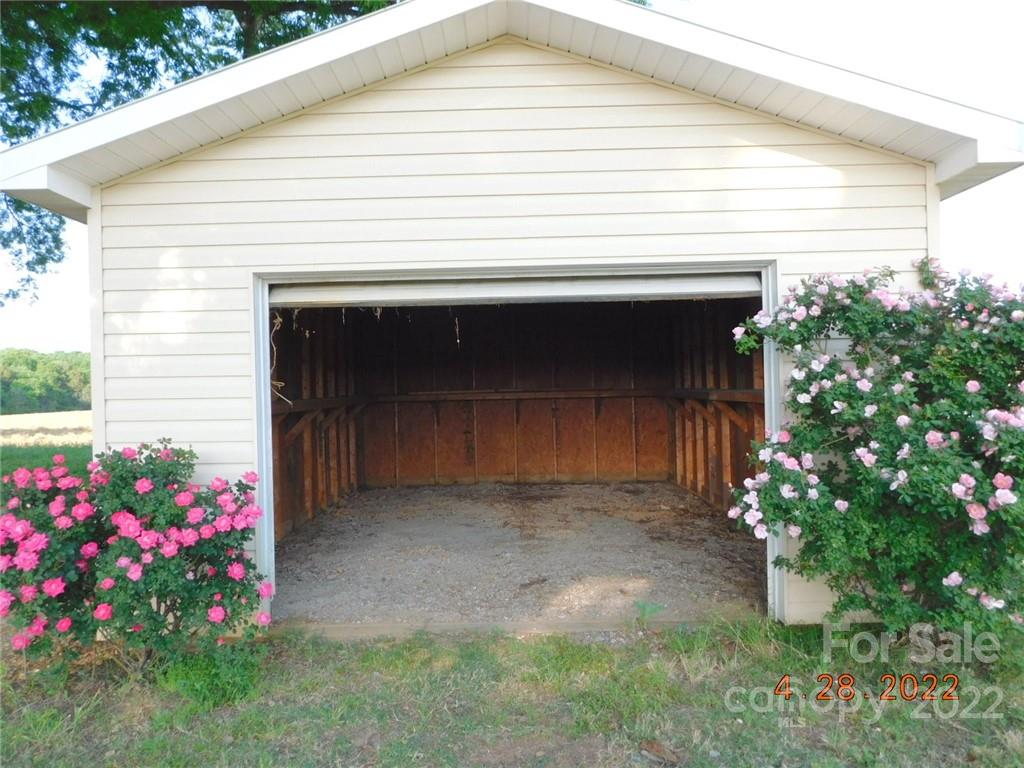 3118 Austin Chaney Road Monroe, NC 28110 - Photo 7 of 15 a front view of a house with a garage