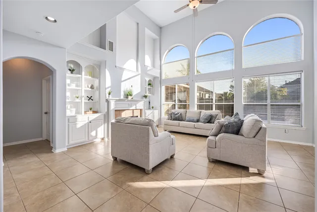 a view of a room with wooden floor and windows