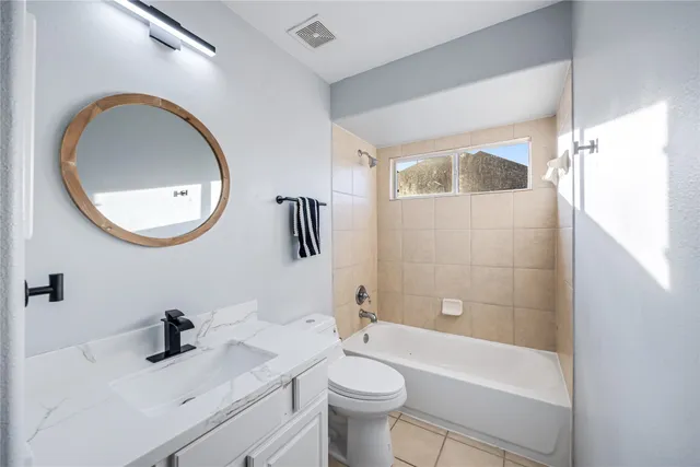 a view of a porch with a floor to ceiling windows and a table