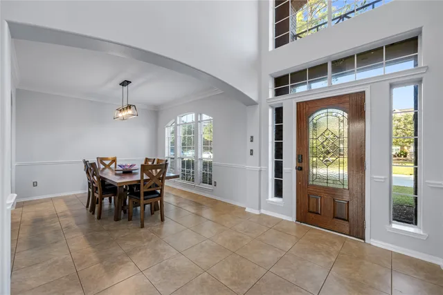a view of a dining room with furniture window and outside view
