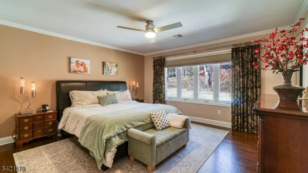 a spacious bedroom with a bed and a couch