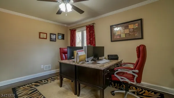 a view of a workspace with furniture