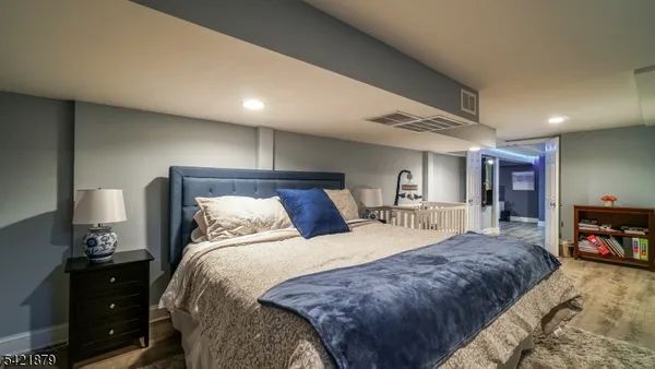 a bedroom with a bed and dresser