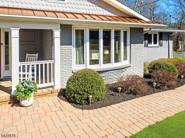 a front view of a house with garden