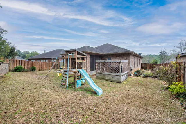 a house with swimming pool in front of it