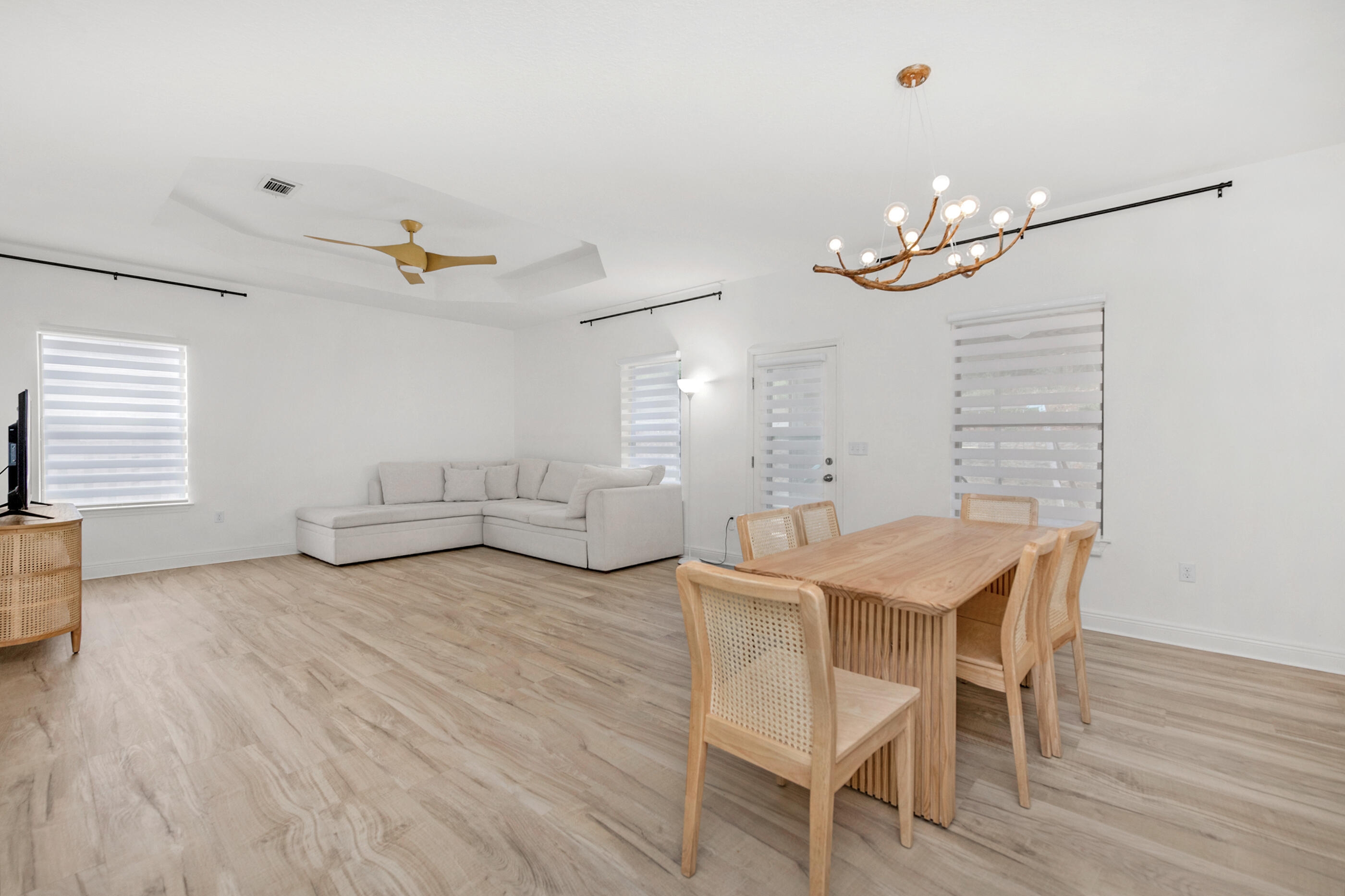 653 Red Fern Road Crestview, FL 32536 - Photo 6 of 34 a view of a dining room with furniture and wooden floor