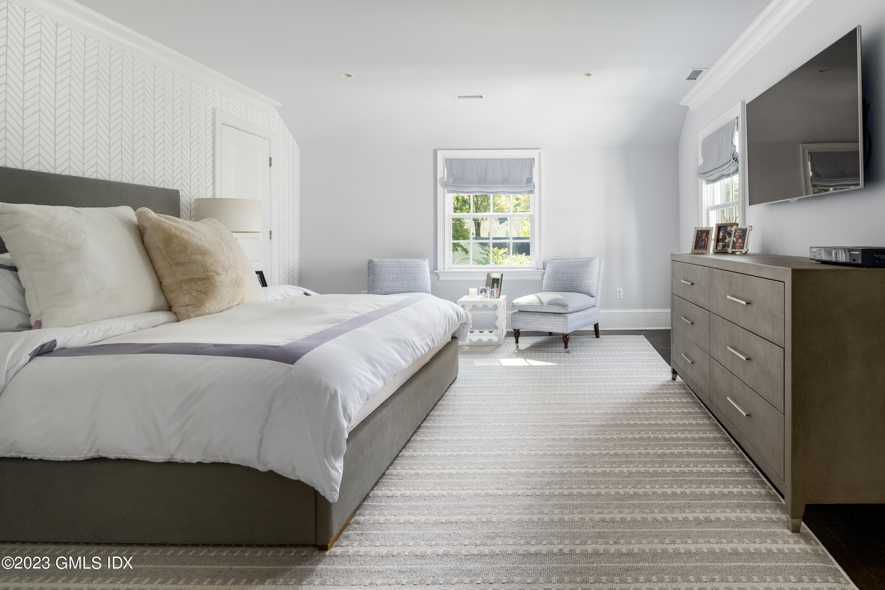 10 Field Road Riverside, CT 06878 - Photo 13 of 18 a bedroom with a bed and flat screen tv