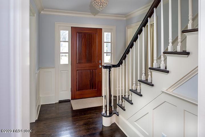10 Field Road Riverside, CT 06878 - Photo 5 of 18 a view of front door with wooden floor and door