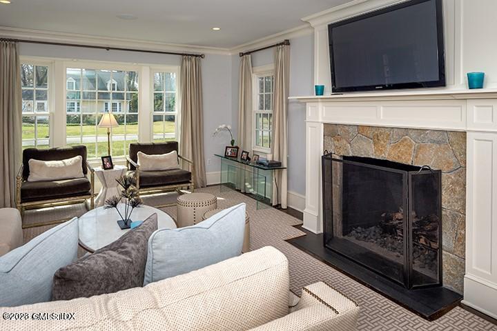 10 Field Road Riverside, CT 06878 - Photo 8 of 18 a living room with furniture and a fireplace