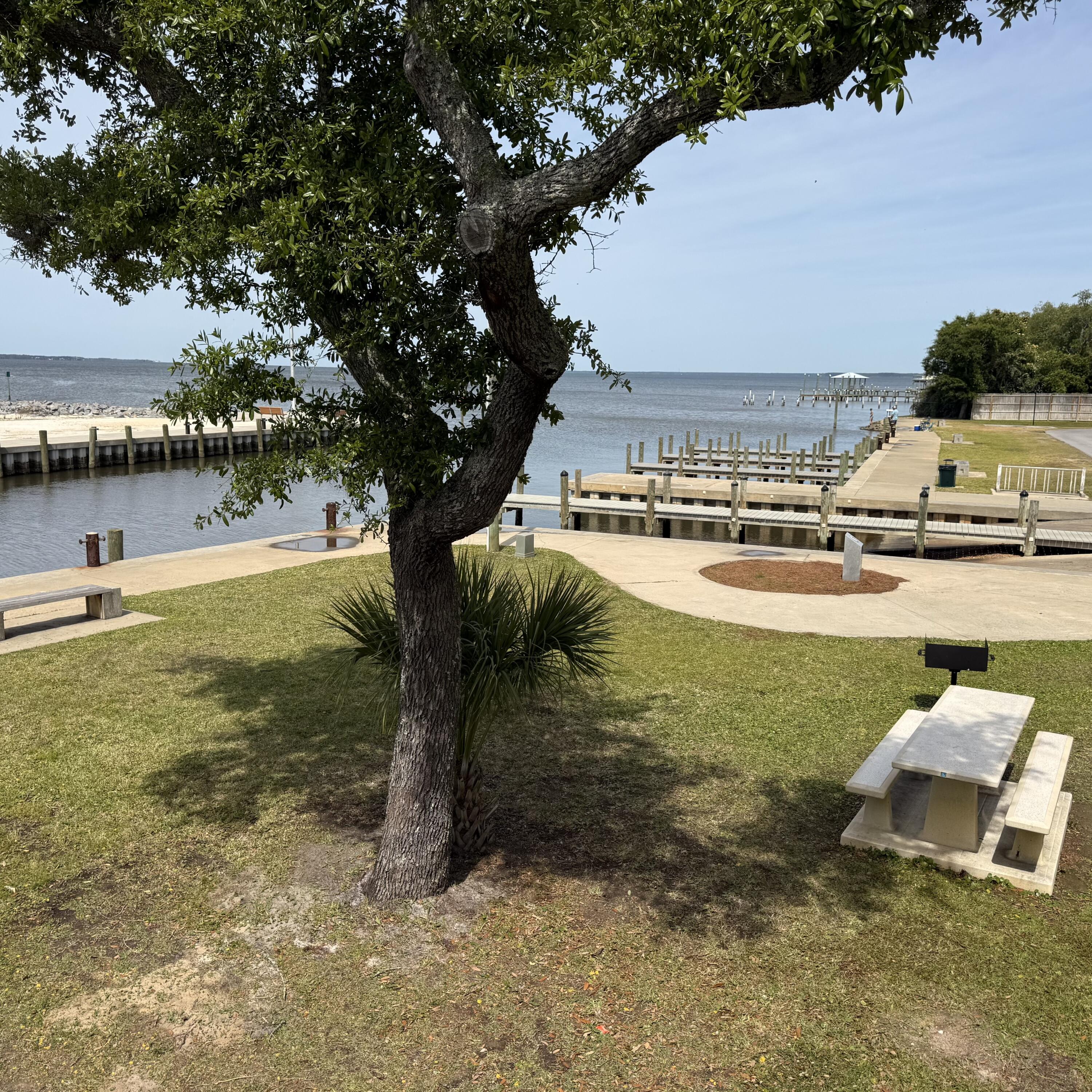 0 Mallet Road Freeport, FL 32439 - Photo 4 of 9 a view of a lake with a yard and large trees