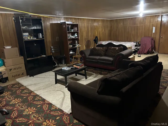a living room with furniture and a rug
