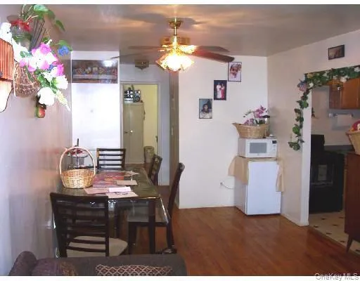 a view of a dining room with furniture and chandelier