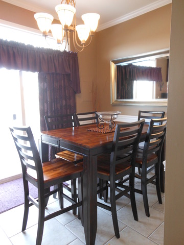 549 Springbrook Trail North Oswego, IL 60543 - Photo 5 of 19 a view of a dining room with furniture and window