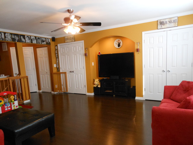 549 Springbrook Trail North Oswego, IL 60543 - Photo 10 of 19 a view of a livingroom with furniture and a flat screen tv