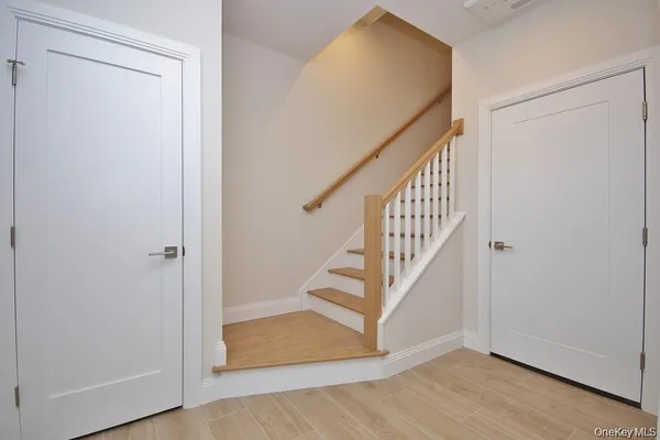 a view of entryway with wooden floor