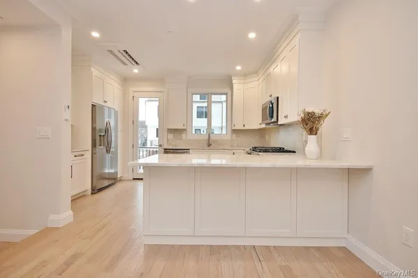 a bathroom with a sink vanity and a mirror