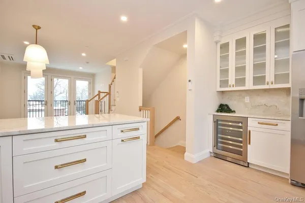 a kitchen with stainless steel appliances a stove microwave and sink