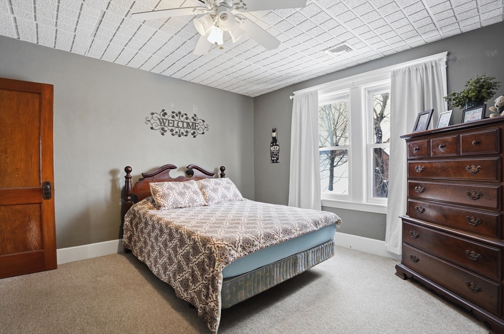24 Ingleside Avenue Worcester, MA 01604 - Photo 28 of 39 a bedroom with a bed and a walk in closet