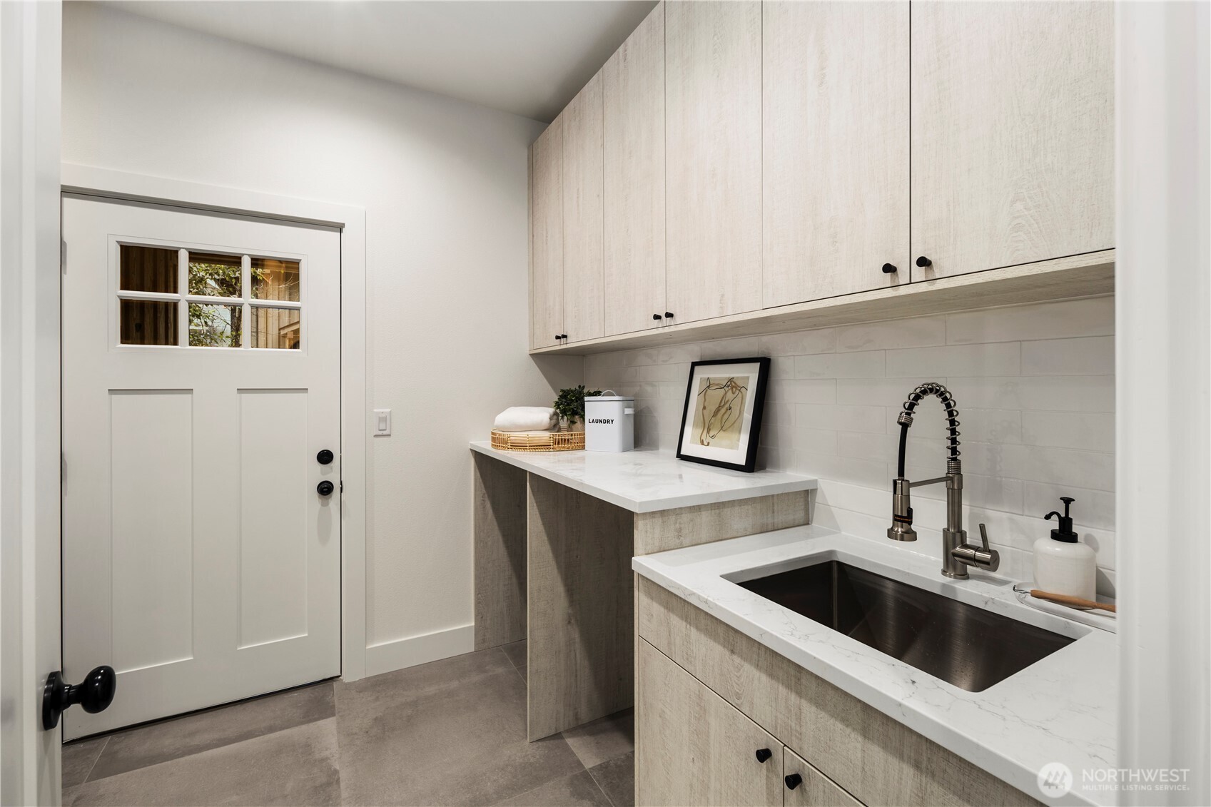 961 Larkspur Loop Cle Elum, WA 98922 - Photo 27 of 40 a kitchen with stainless steel appliances granite countertop a sink and a refrigerator with white cabinets