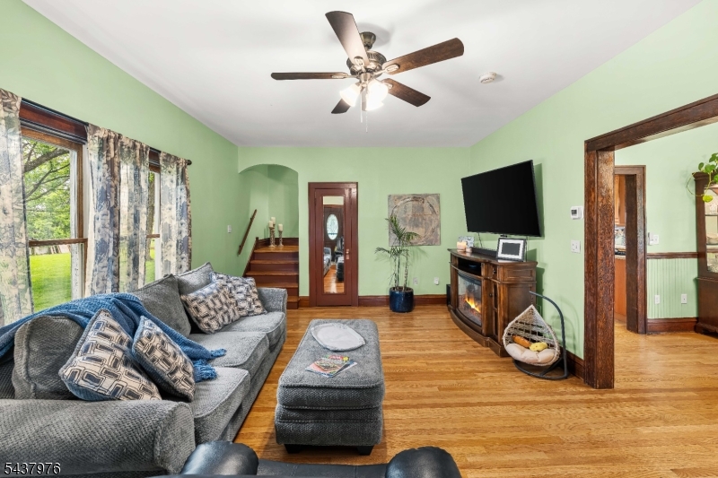 886 Brass Castle Road Belvidere, NJ 07823 - Photo 6 of 44 a living room with furniture a flat screen tv and a large window
