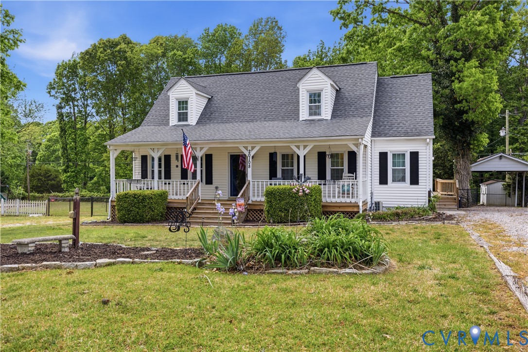 20108 Eugene Drive Sutherland, VA 23885 - Photo 2 of 41 a front view of a house with a yard table and chairs