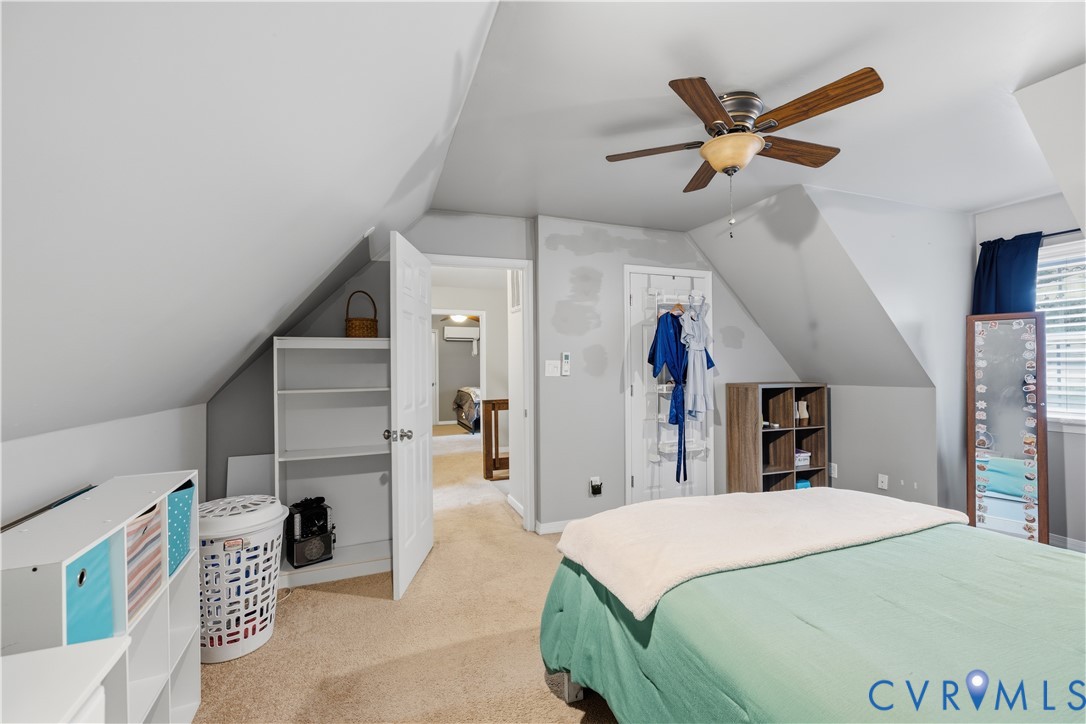 20108 Eugene Drive Sutherland, VA 23885 - Photo 23 of 41 a bed room with a bed and a chandelier
