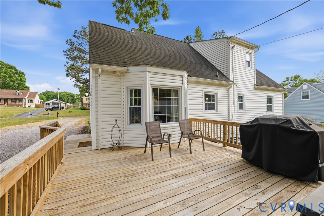 20108 Eugene Drive Sutherland, VA 23885 - Photo 29 of 41 a view of a house with a barbeque and wooden floor