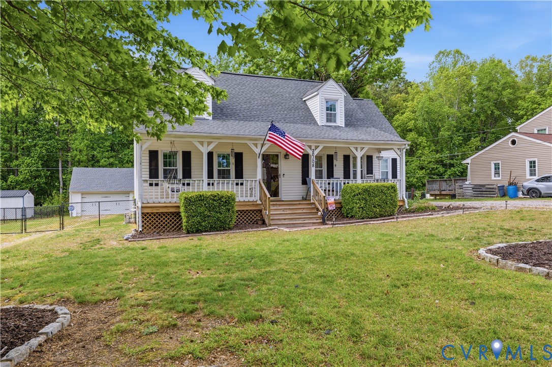 20108 Eugene Drive Sutherland, VA 23885 - Photo 4 of 41 a front view of a house with a garden and trees