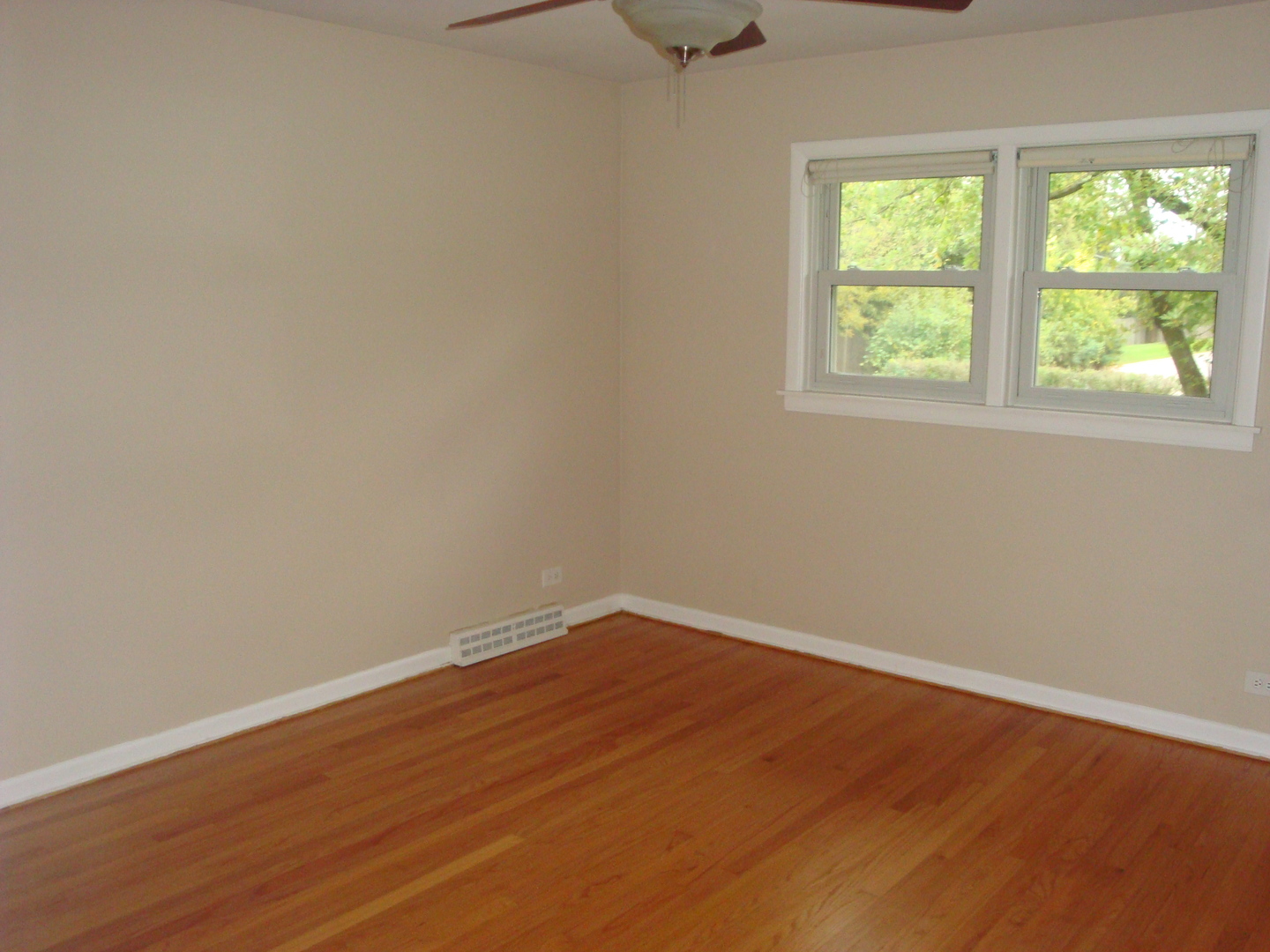 601 Forest Road La Grange Park, IL 60526 - Photo 15 of 22 an empty room with wooden floor and windows