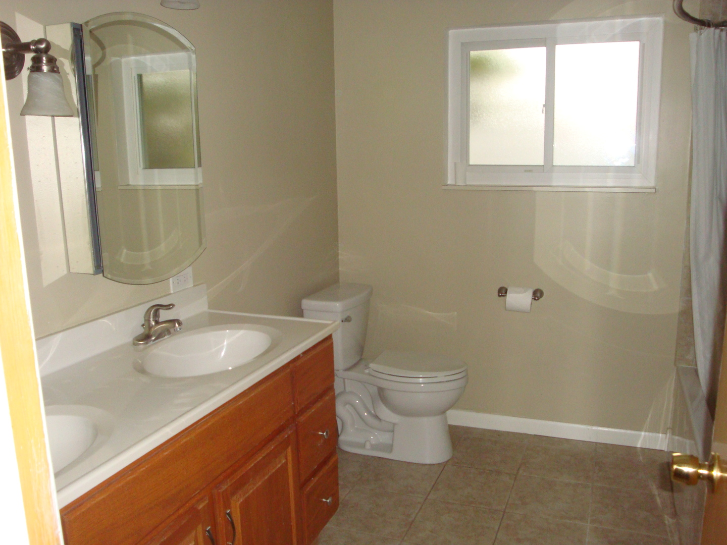 601 Forest Road La Grange Park, IL 60526 - Photo 17 of 22 a bathroom with a sink and a mirror