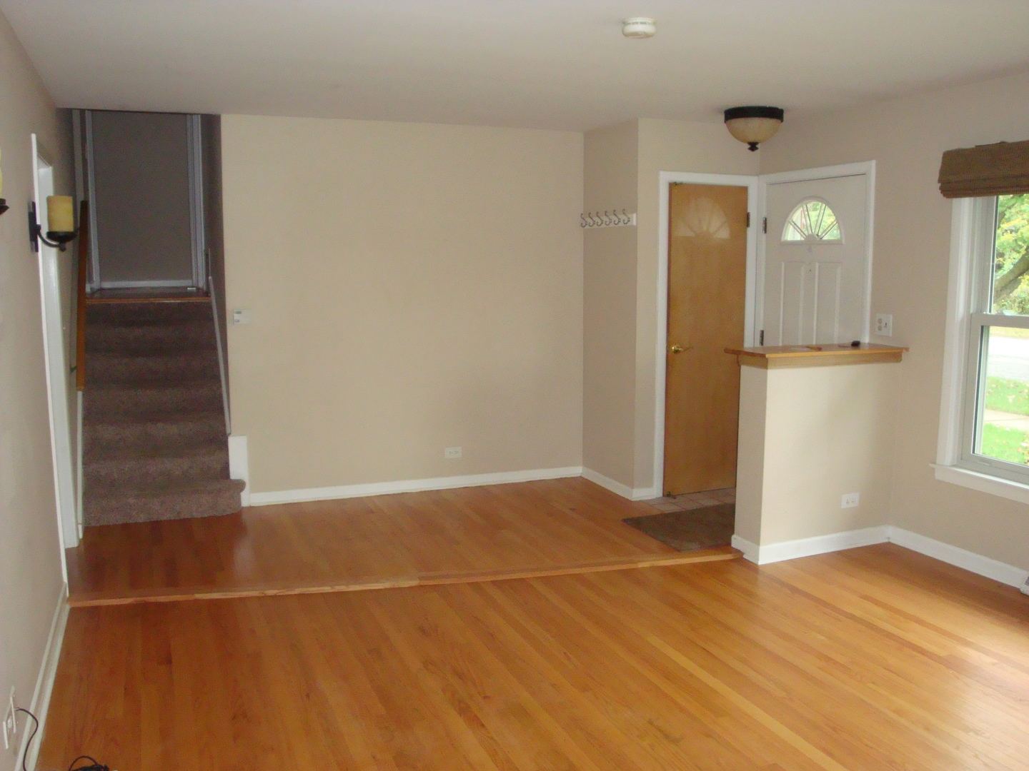 601 Forest Road La Grange Park, IL 60526 - Photo 7 of 22 a view of an empty room with window and wooden floor
