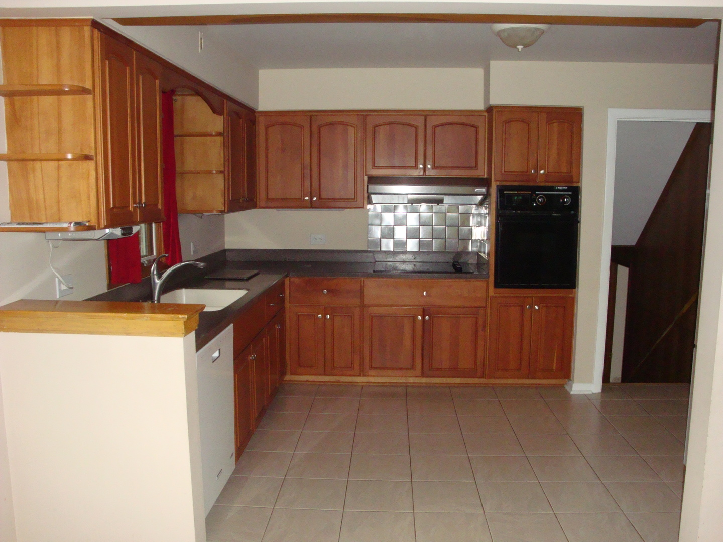 601 Forest Road La Grange Park, IL 60526 - Photo 10 of 22 a kitchen with stainless steel appliances granite countertop a refrigerator and a stove top oven