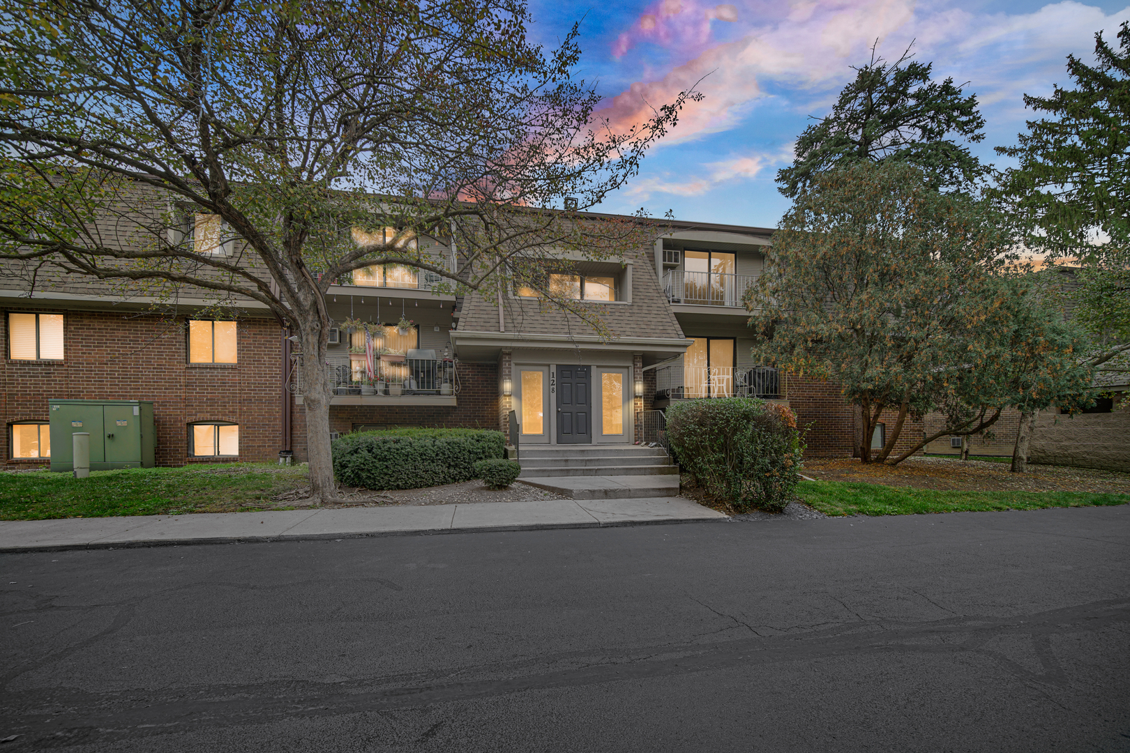 a front view of a building with garden