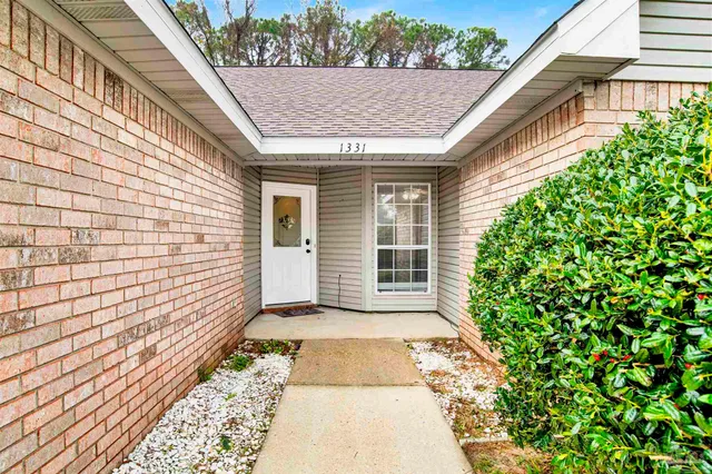 a view of a backyard with pathway