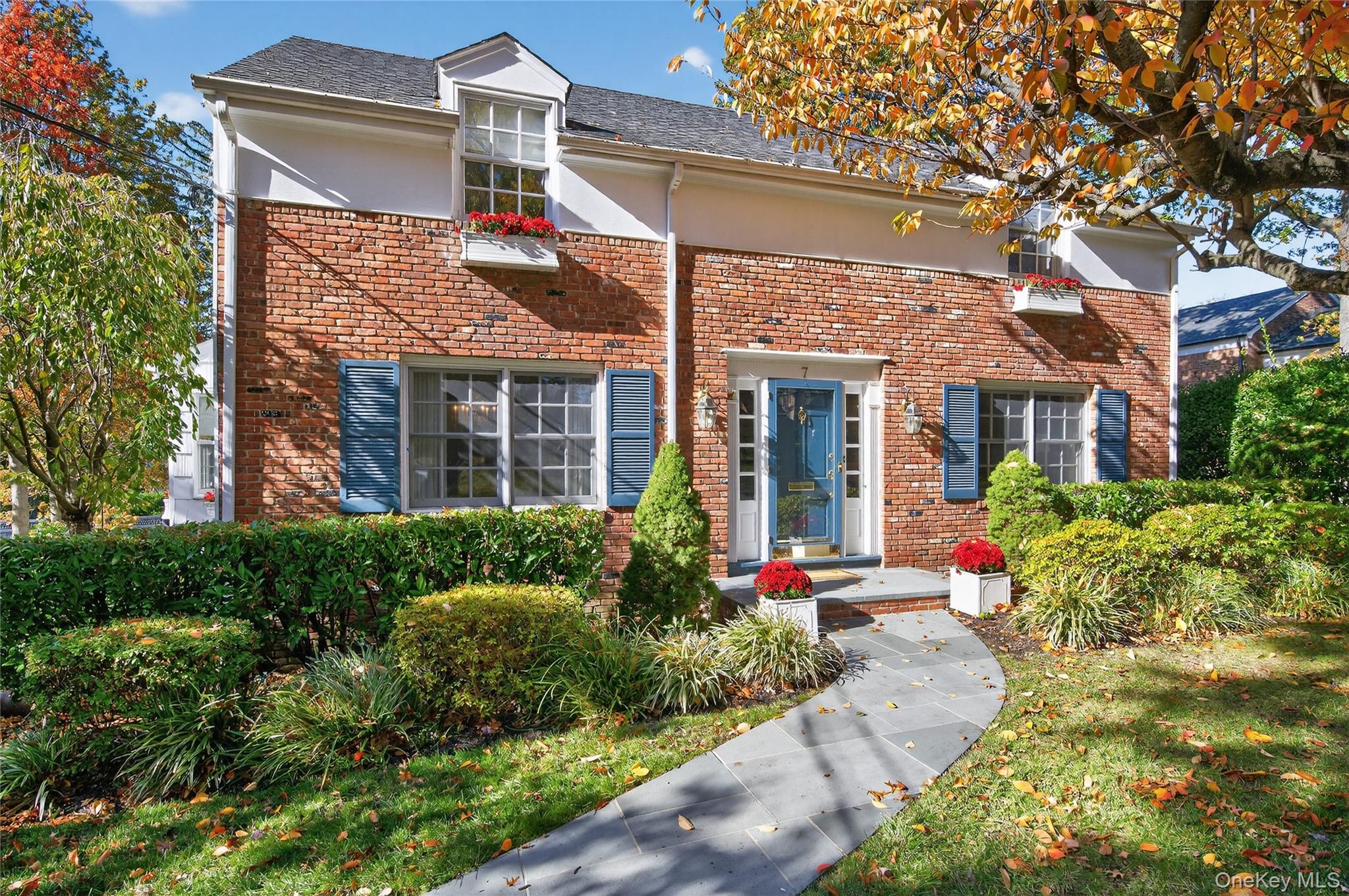 front view of a house with a yard