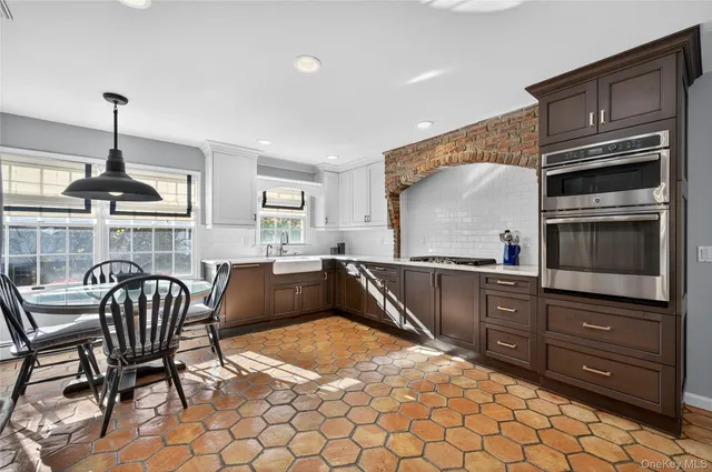 a kitchen with a sink cabinets and appliances