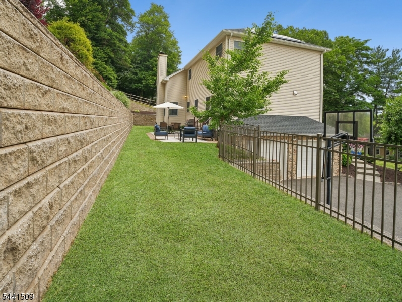 610 River Road Chatham, NJ 07928 - Photo 35 of 42 a view of a backyard with sitting area