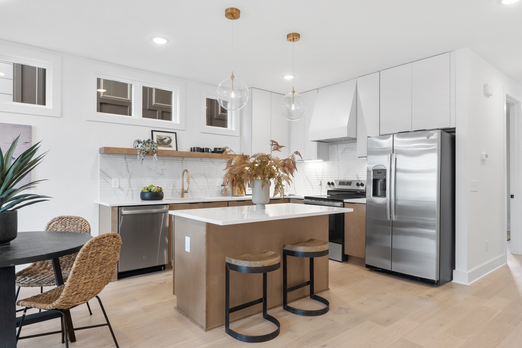 3021 Edwin Street Nashville, TN 37207 - Photo 11 of 48 a kitchen with white cabinets and stainless steel appliances