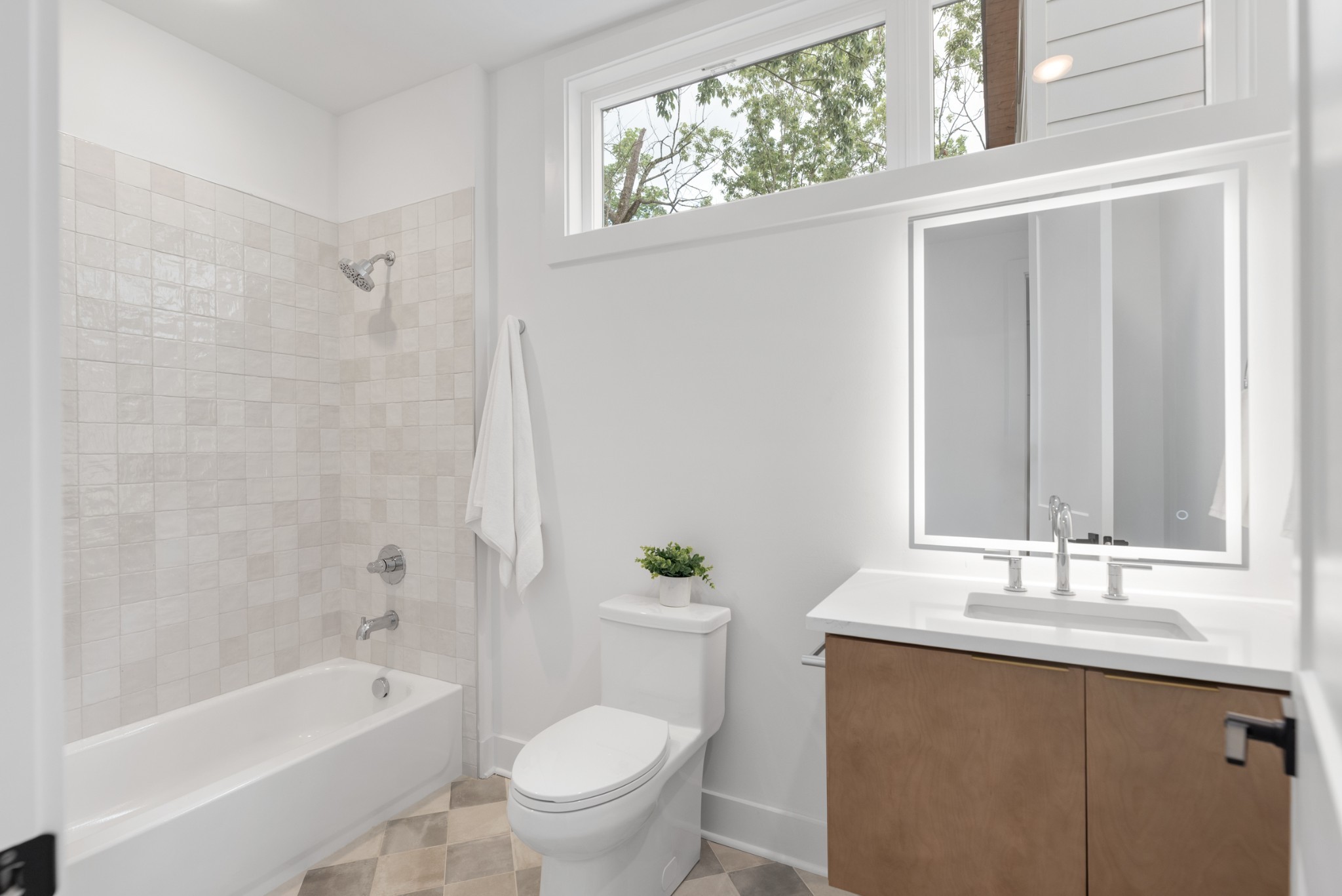 3021 Edwin Street Nashville, TN 37207 - Photo 19 of 48 a bathroom with a granite countertop sink a toilet a mirror a bathtub and shower