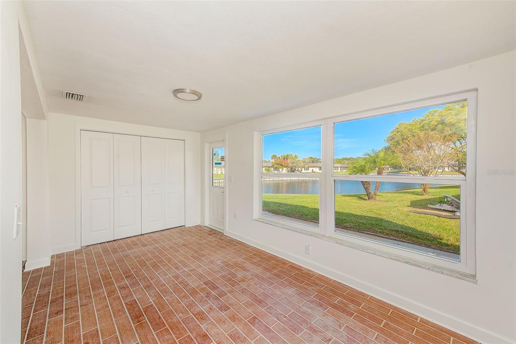 4308 Summersun Drive New Port Richey, FL 34652 - Photo 11 of 42 a view of a room with wooden floor and walls