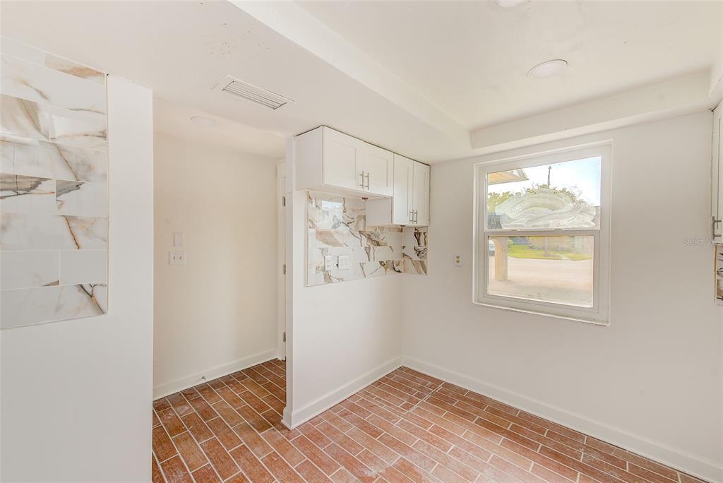 4308 Summersun Drive New Port Richey, FL 34652 - Photo 15 of 42 a view of an empty room with window and wooden floor