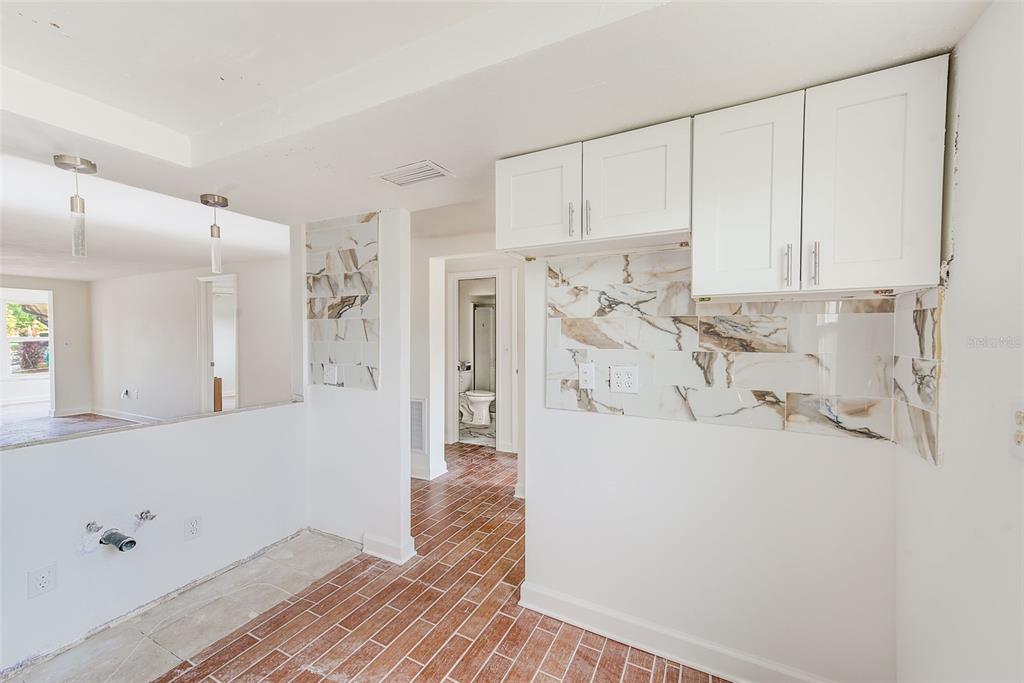 4308 Summersun Drive New Port Richey, FL 34652 - Photo 17 of 42 a view of a kitchen with white cabinets